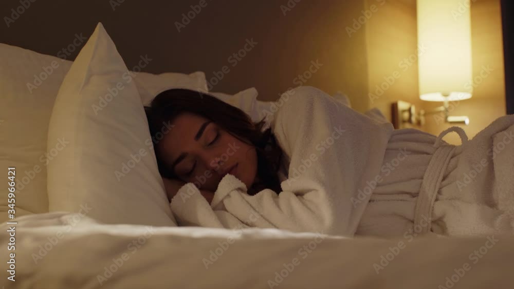 surface level view of beautiful girl sleeping in hotel apartment