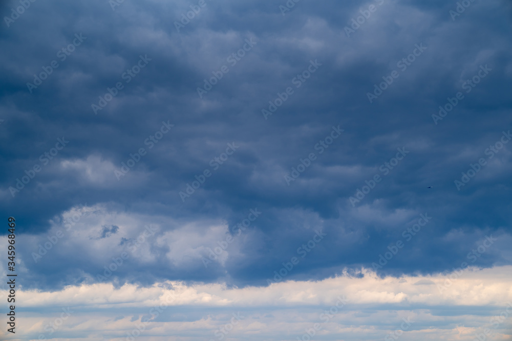 dark grey cloudy sky with epic clouds above city. dark grey cloudy sky with epic clouds above city.