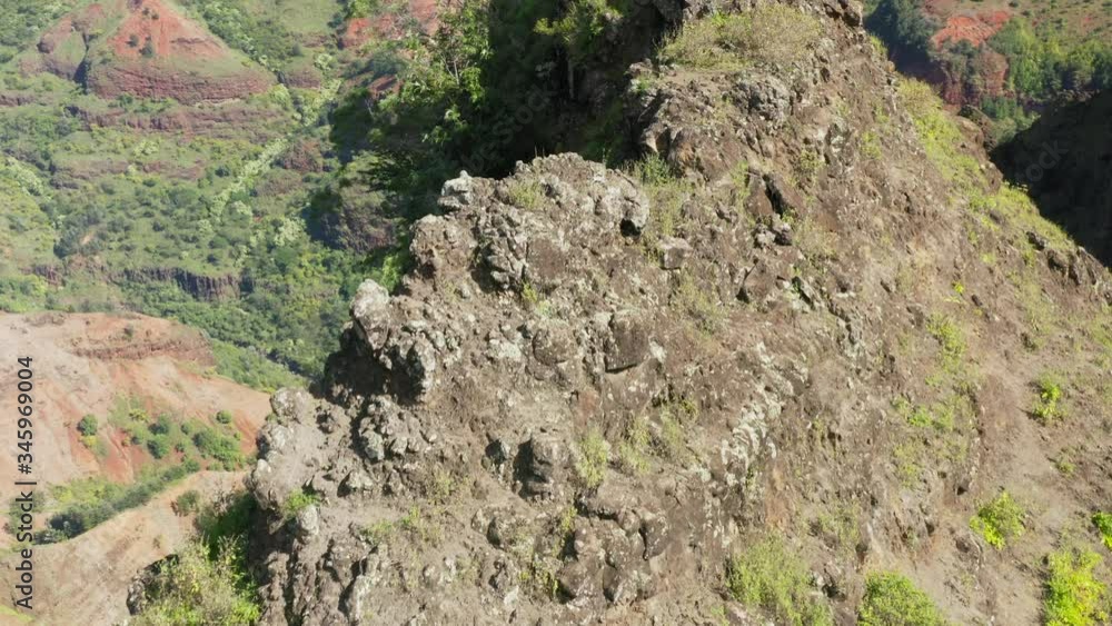 Crest and gorge of well-known travel location of Hawaii, the Waimea Canyon. Aerial view over the top of the volcanic rocky ridge and into the deep and dark narrow ravine beside it. 4K Crest and gorge of well-known travel location of Hawaii, the Waimea Canyon. Aerial view over the top of the volcanic rocky ridge and into the deep and dark narrow ravine beside it. 4K
