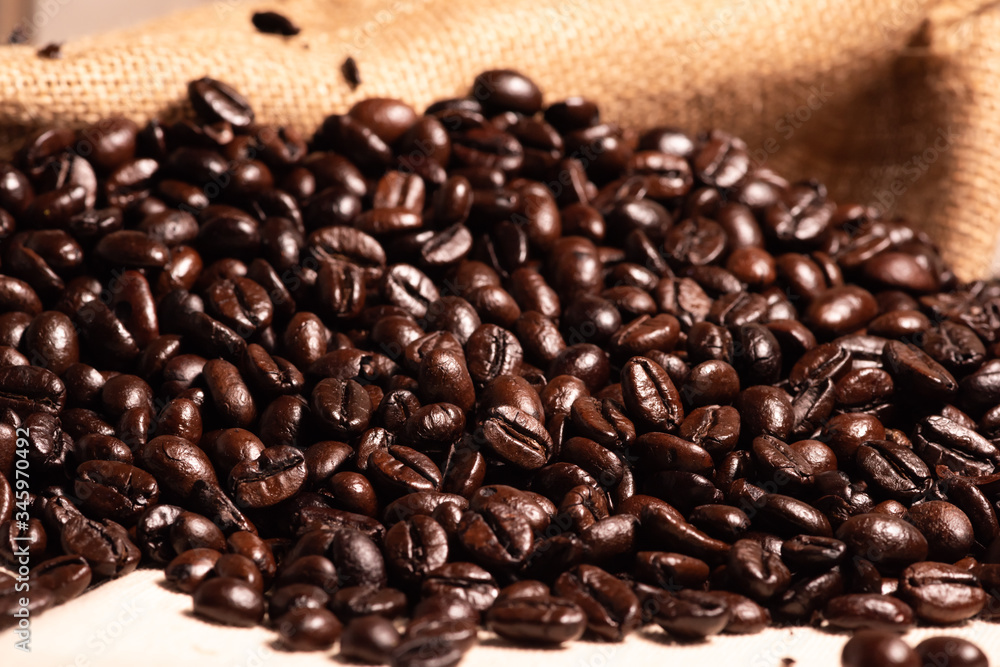 Close-up fresh roasted coffee beans in brown sack. Close-up fresh roasted coffee beans in brown sack.