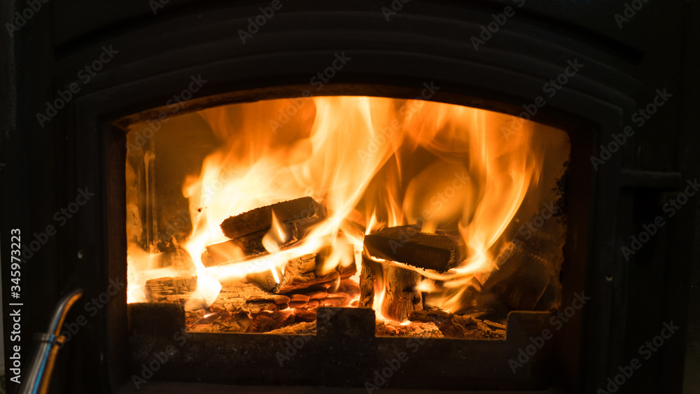 Burning logs in a fireplace at home, Cyprus. Burning logs in a fireplace at home, Cyprus.