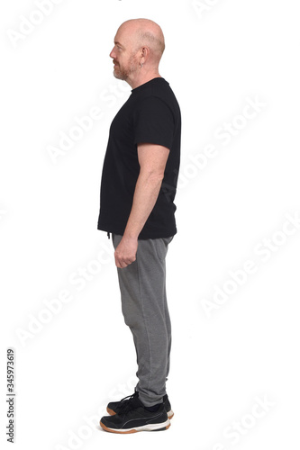man with sportswear in profile on white background