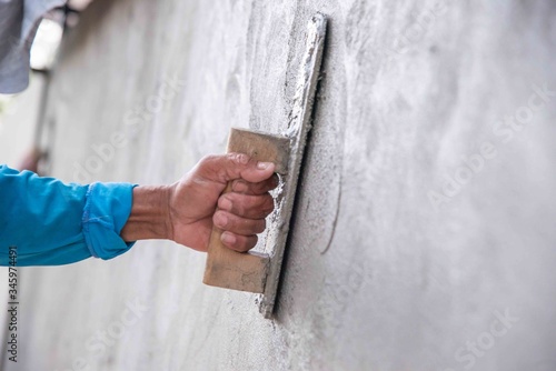 mason rural thailand Plastering concrete to build wall background industrial worker with plastering tools renovating house concept quality