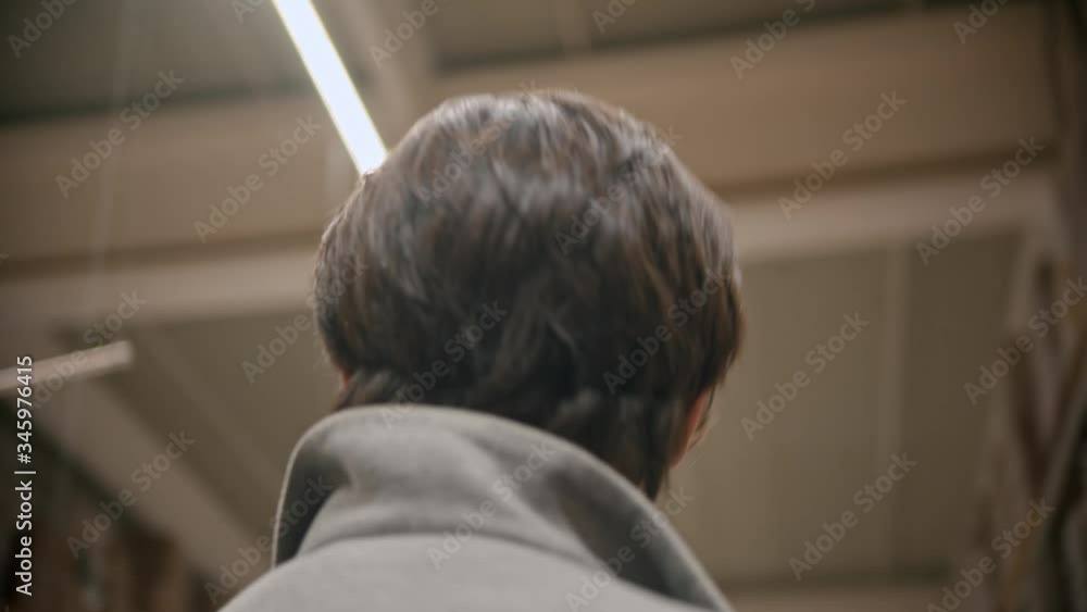 Young man in protective mask walking in the grocery shop and looking around Young man in protective mask walking in the grocery shop and looking around