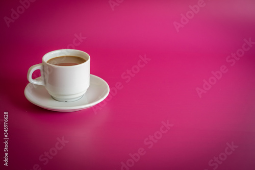 white cup of coffee on background