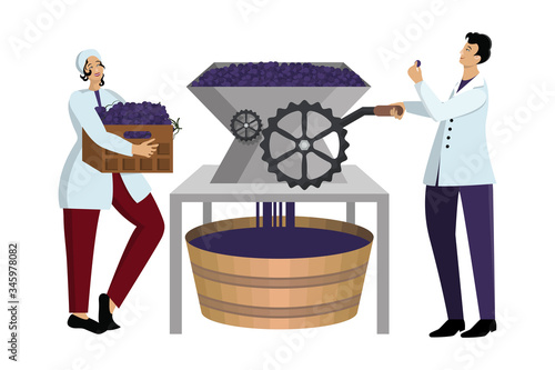 Man and woman winemakers in work uniform crumple grapes on industrial equipment at winery