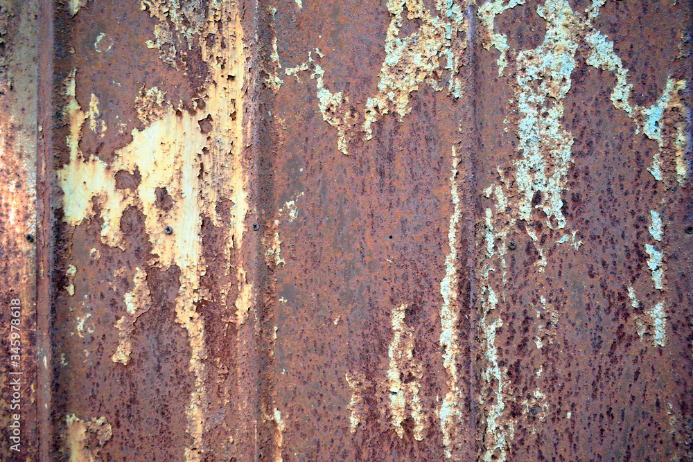 Rusty old metal surface with the remains of blue paint. Rusty old metal surface with the remains of blue paint.