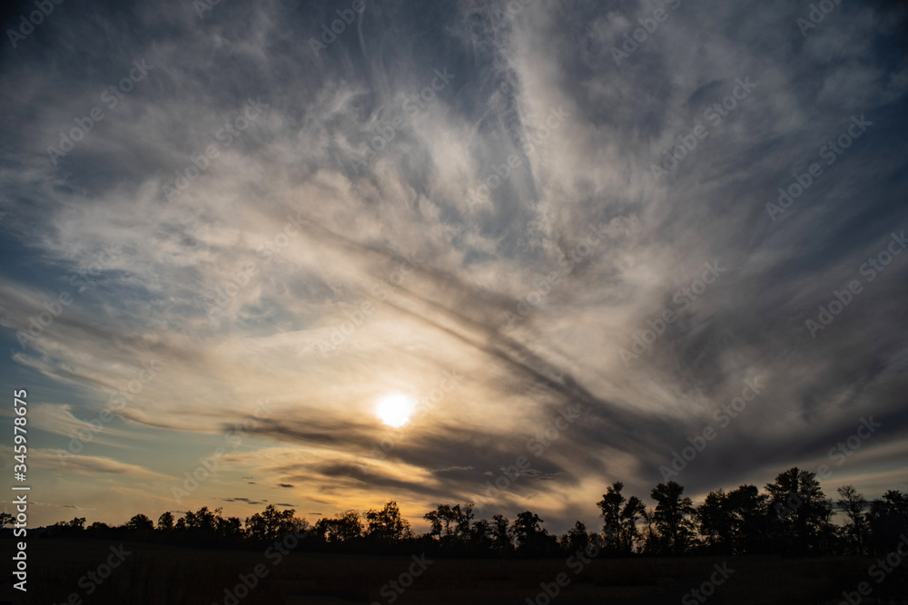 Sunset with bright fantastic clouds over the edge of the black forest. Sunset with bright fantastic clouds over the edge of the black forest.