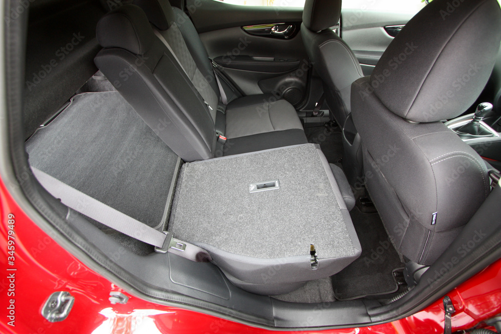 Partially folded rear seat of compact SUV