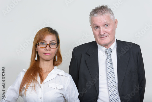 Mature multi ethnic business couple working together