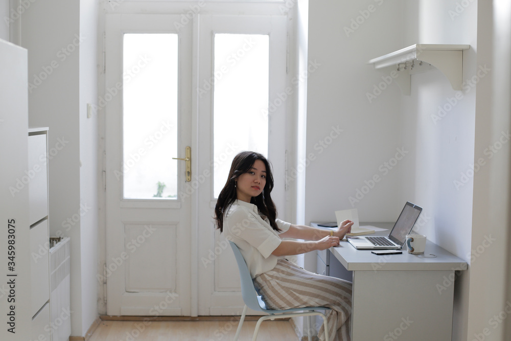 A woman is working from home