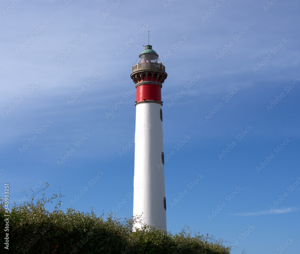 Lighthouse on a background of blue sky, Ouistreham, France Lighthouse on a background of blue sky, Ouistreham, France