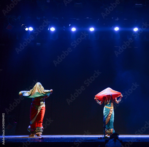 Dancers doing the Mujra in the popular Maharashtrian Folk dance form called Lavani photo