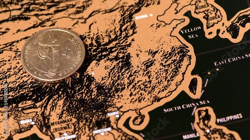 one dollar golden coin spinning on blogger scratch travel map oh China photo