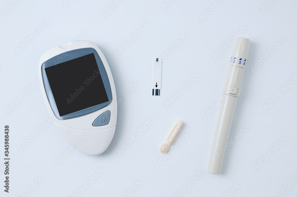 Electronic glucometer, lancet and test strip for determining blood ...