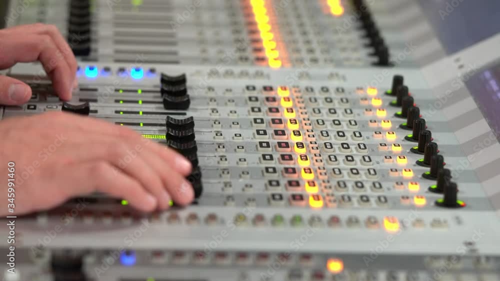 Sound Engineer Moving Sliders In Radio Station. Sound Designer Used
