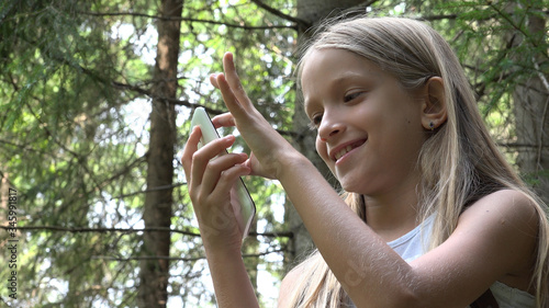 4K Child Playing Smartphone, Little Girl Using Mobile in Mountains Trails Forest