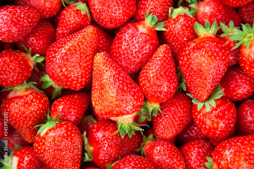 background of freshly picked strawberries, top view, close-up