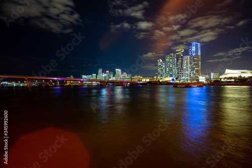 Miami City Skyline viewed from Biscayne Bay. Bayside Marketplace Miami Downtown behind MacArthur Causeway shot from Venetian Causeway.