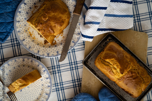 HOT HOME BREAD, ON A TABLE WITH TRADITIONAL TABLECLOTH