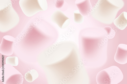White and pink marshmallows falling. Blurred marshmallow candy background.