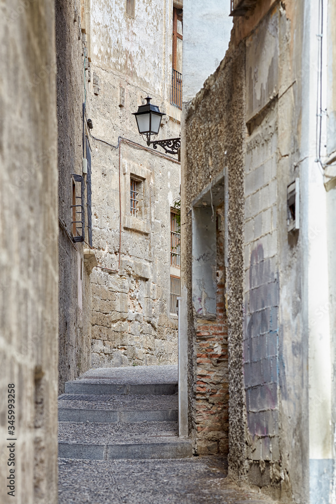 A narrow street in Albaicin - the Moorish quarter in Granada, Spain