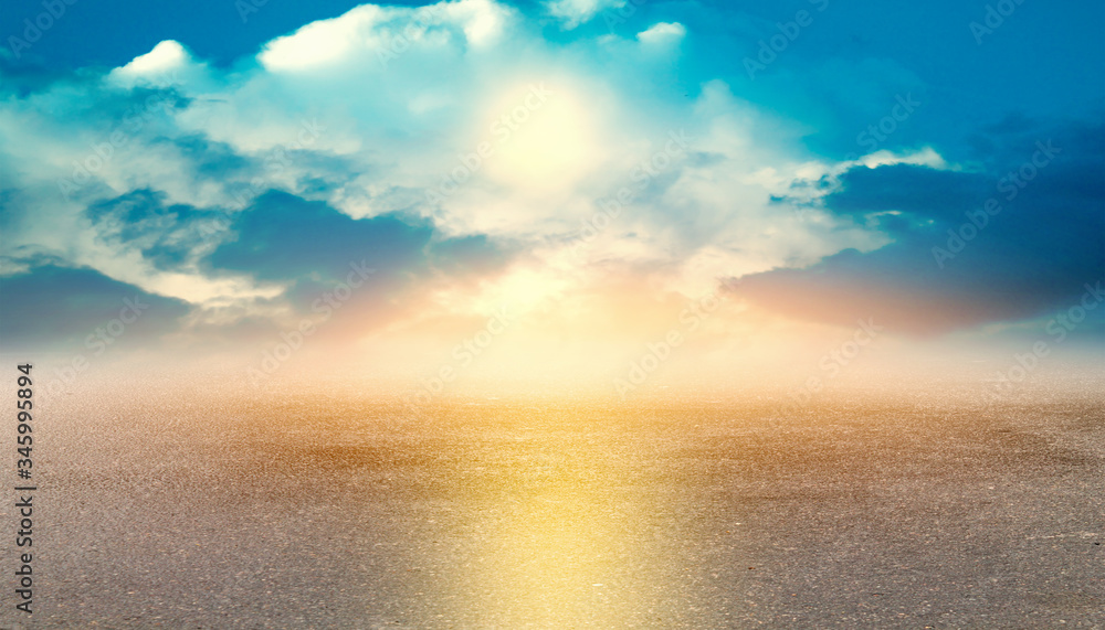 Asphalt road, sunset on a cloudy sky Asphalt road, sunset on a cloudy sky