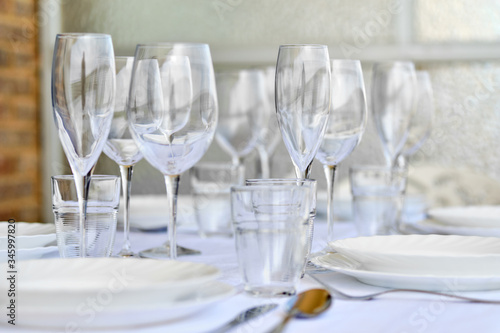 Table settings with diverse glassware and tableware close up