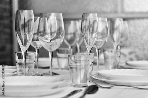Table settings with diverse glassware and tableware closeup