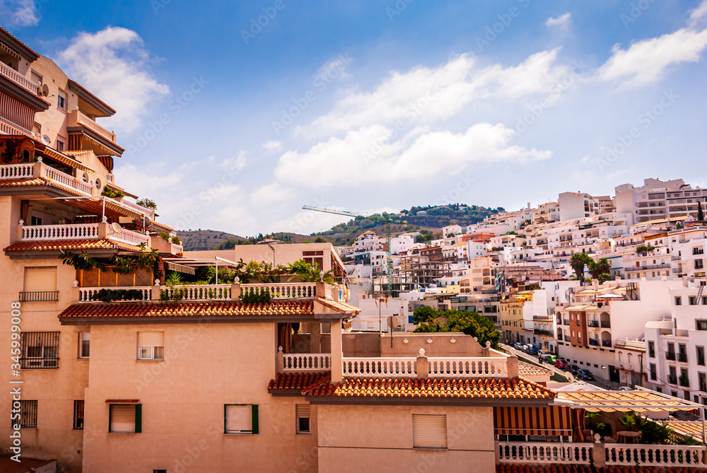 Panorama of hillside houses and apartments at the sunny Costa Tropical town of La Herradura, Granada, Spain