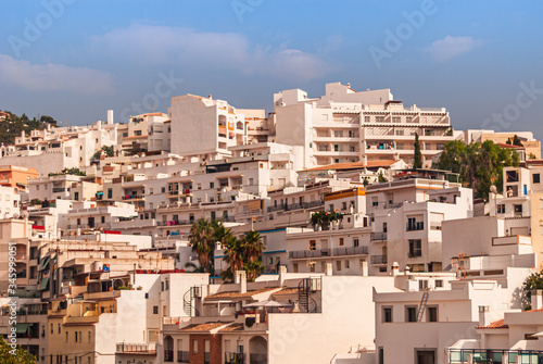 Obraz na płótnie Hillside houses and apartments on a sunny, summer afternoon in the Costa Tropical town of La Herradura, Granada, Spain w salonie