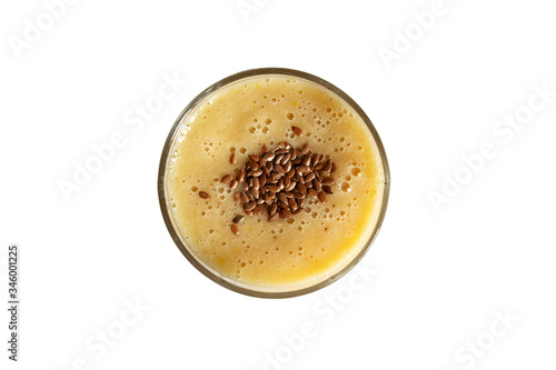 A glass with orange-banana smoothie isolated on a white background