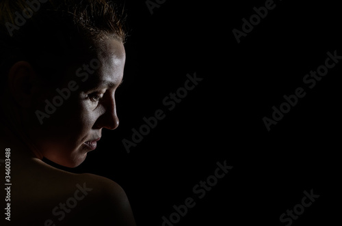 Silhouette portrait of a girl isolated on a dark background   © Cliff