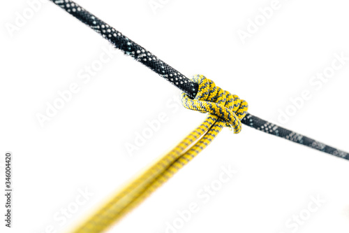 A special knot or hitch called Prusik (prussik). Sliding friction hitch used in rock climbing and mountaineering. Prusik loop on a climbing rope. Safety or rescue rope technique.