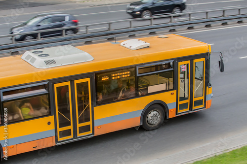  City Bus Moves along the Highway