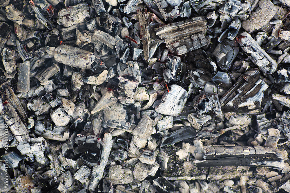 Smoldering ashes of a bonfire, as background. Smoldering ashes of a bonfire, as background.