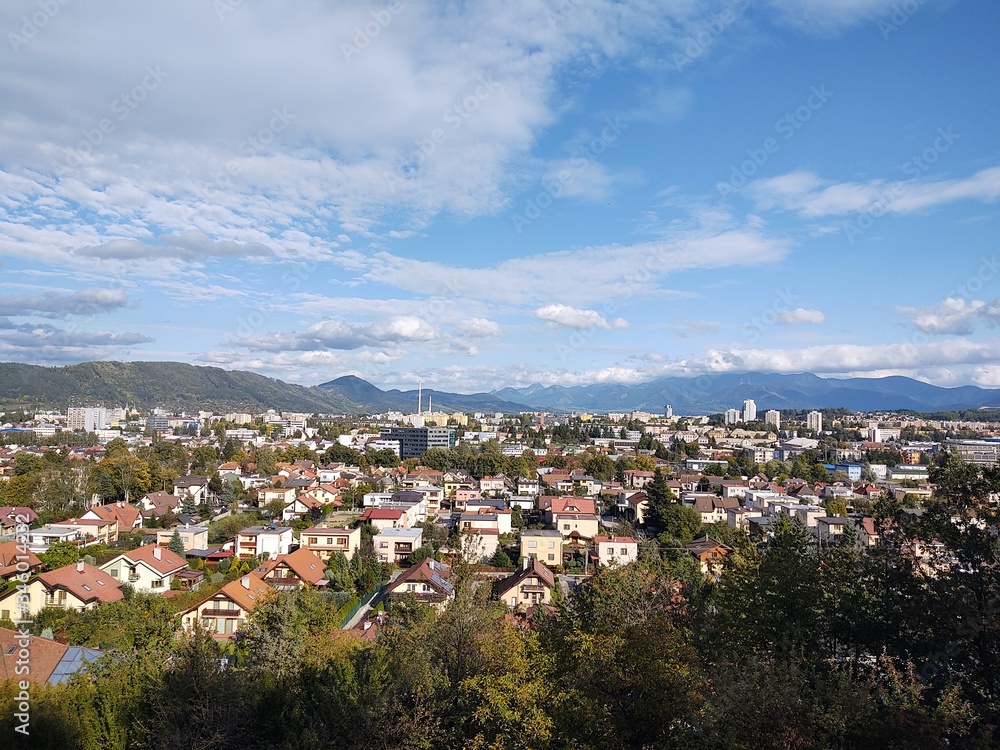 Sunrise and sunset, beautiful clouds over the meadow, hills and buildings in the town. Slovakia Sunrise and sunset, beautiful clouds over the meadow, hills and buildings in the town. Slovakia