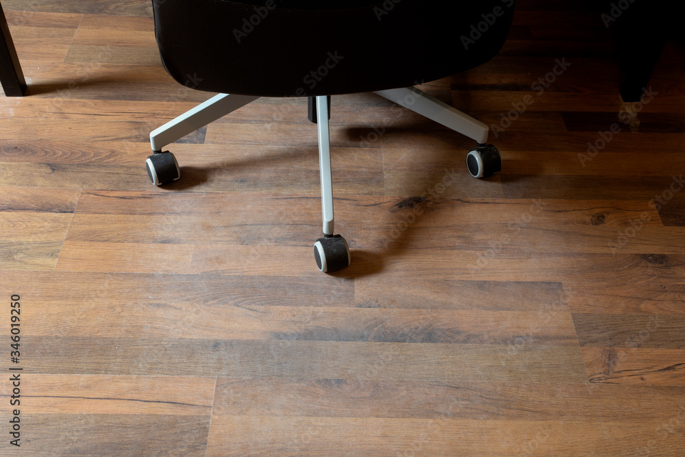 Damaged Laminate Floor from office chair wheels in a home, needs
