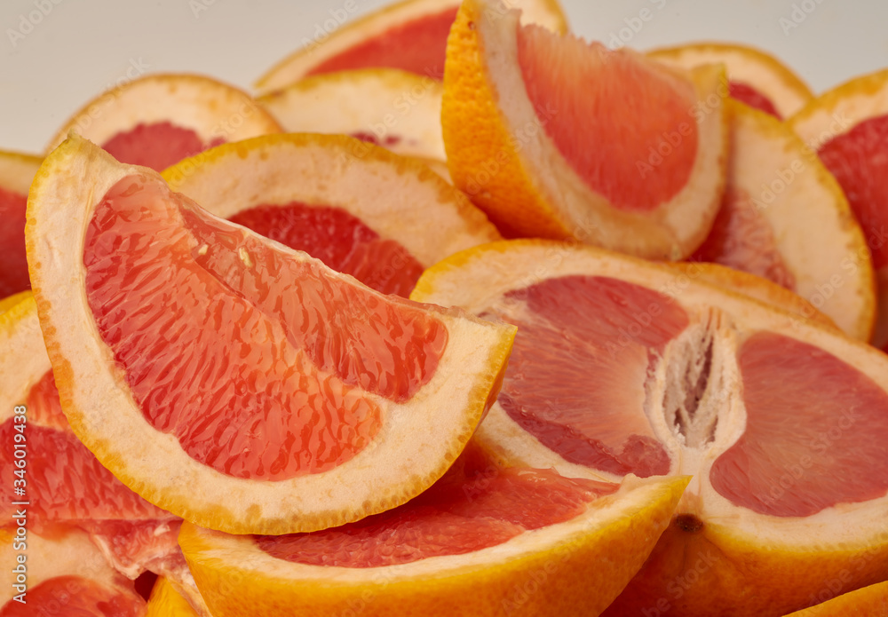 Grapefruit web banner background. Pile of fresh cut grapefruits. Fruits summer bright concept Grapefruit web banner background. Pile of fresh cut grapefruits. Fruits summer bright concept