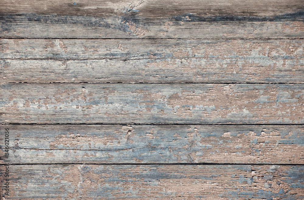 Old wooden floor is made of planks with peeling paint in brown tones. Old wooden floor is made of planks with peeling paint in brown tones.