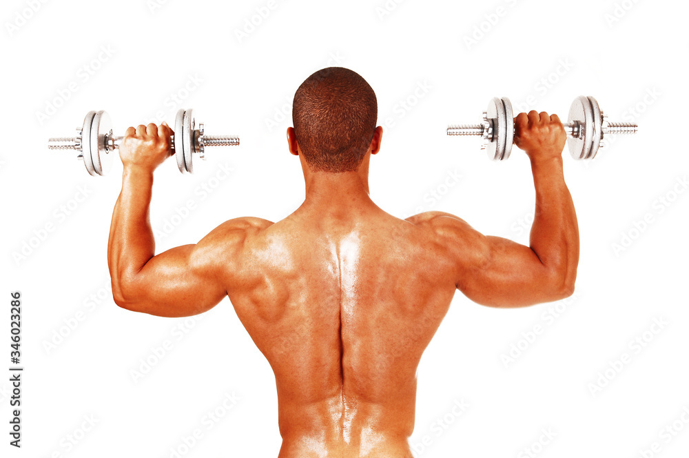 Man working out whit two dumbbells from back Man working out whit two dumbbells from back