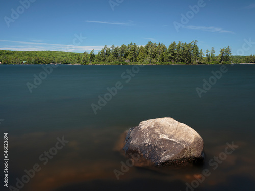 A long exposure Eagle Lake with a rock in the foreground, Sundridge, Ontario