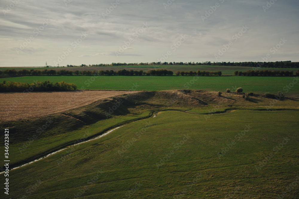 green valley with a small river. green meadows and fields. Landscapes of Moldova. travels in the north of moldova