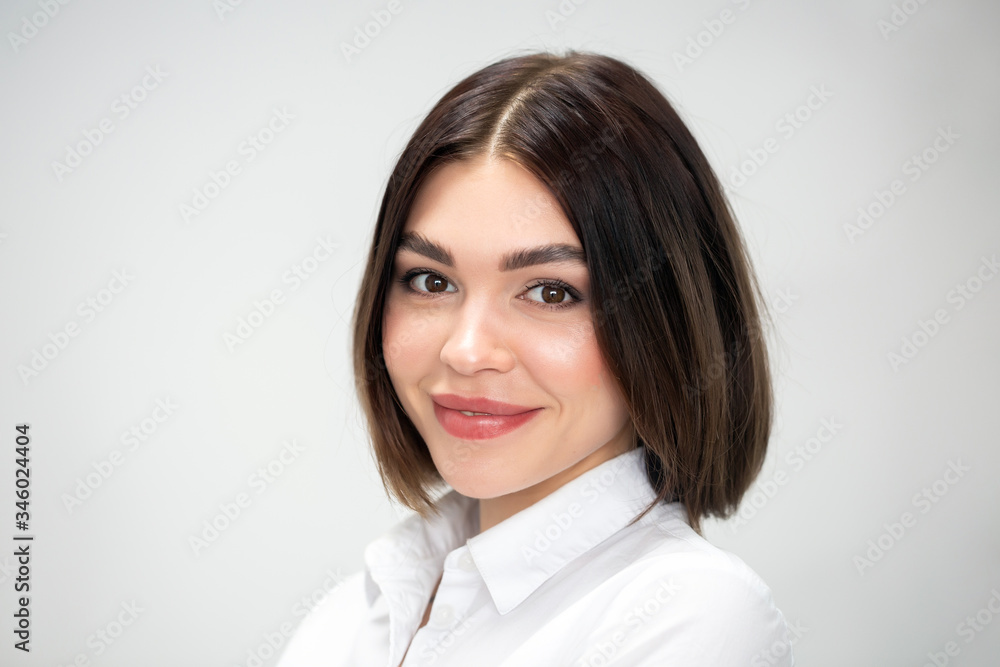 Beautiful close up face of a young woman in white uniform with clean fresh skin, closeup on white. Beauty girl portrait. Perfect fresh skin. Woman in white work clothes. Beautiful close up face of a young woman in white uniform with clean fresh skin, closeup on white. Beauty girl portrait. Perfect fresh skin. Woman in white work clothes.