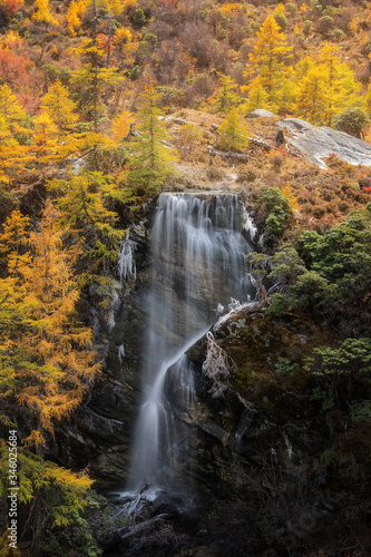 Beautiful waterfall Autumn scene in Yading Nature Reserve, Daocheng County, Sichuan, China