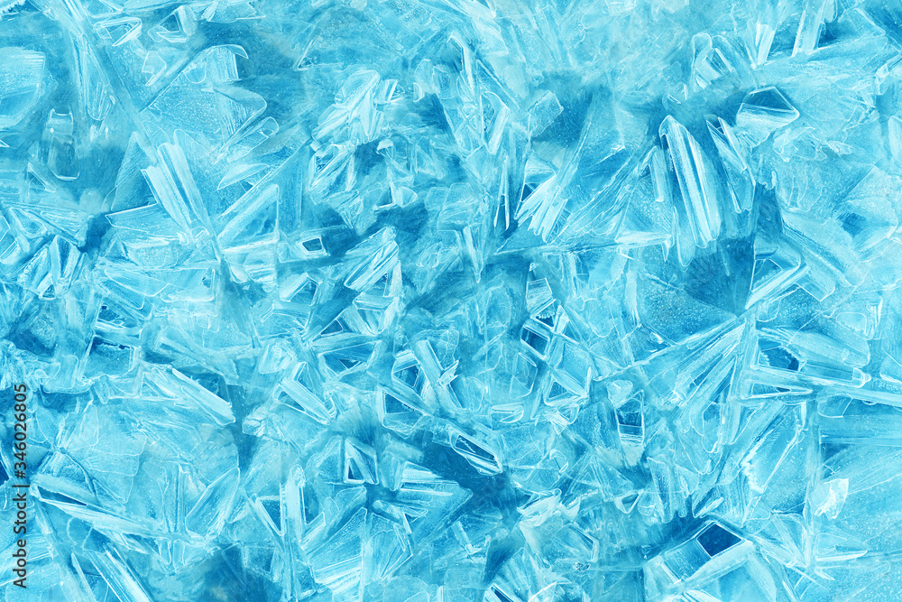 Ice crystal texture. Transparent ice crystals cracked background. Frozen water surface Ice crystal texture. Transparent ice crystals cracked background. Frozen water surface
