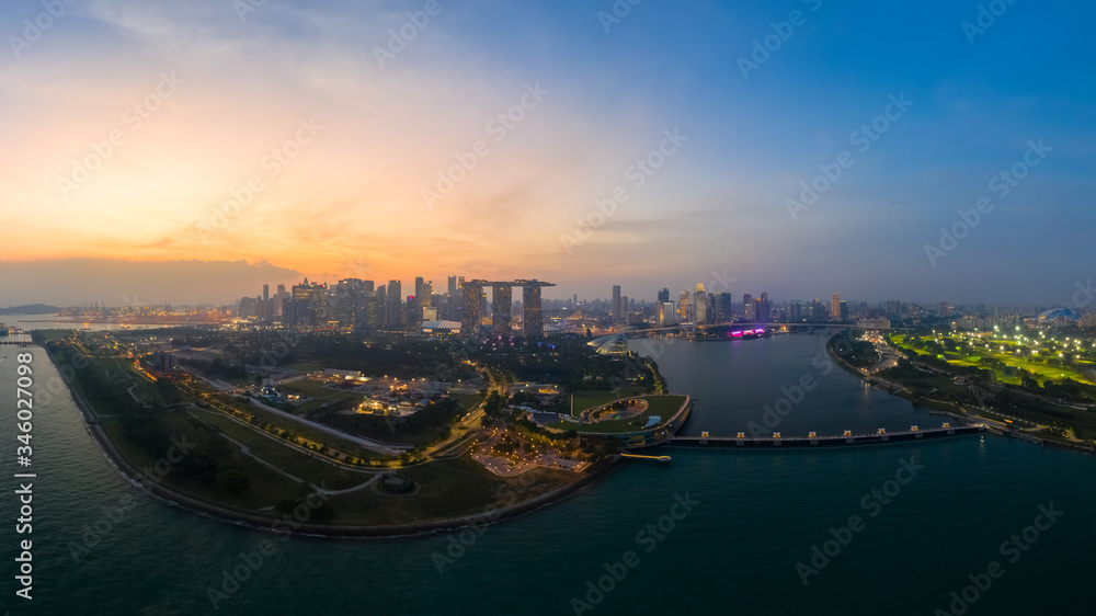 Drone view of Singapore Gardens by the Bay botanical gardens and Marina bay sands at twilight
