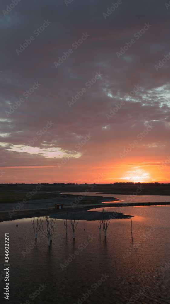 Sunset on the epecuen lake, the orange sky.