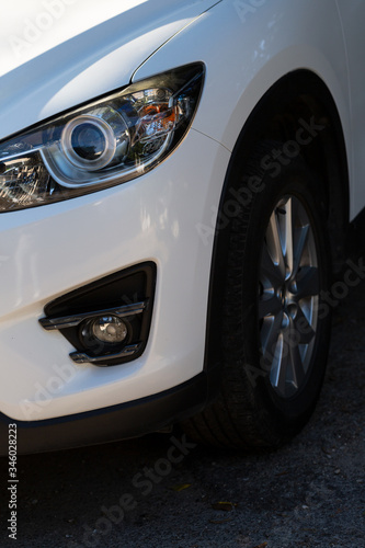 Clean headlights of white car. Close-up, headlight car Projector/LED of a modern luxury technology and auto detail