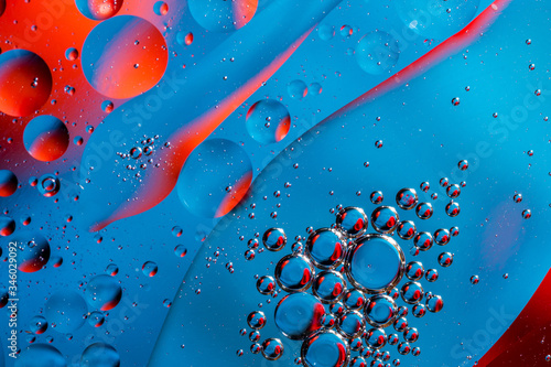 multicolored drops of oil in the water